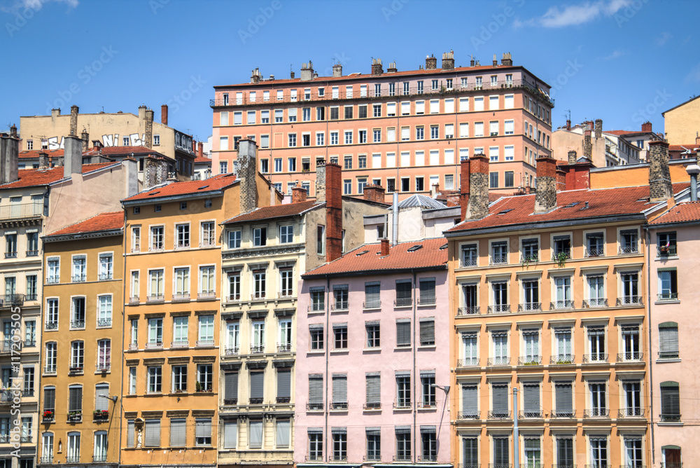 Typical facades of the houses in Lyon, France on the banks of the Saone river
