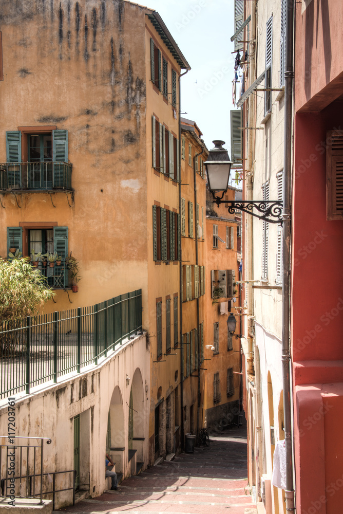 Fototapeta premium Facades of houses in a small street in Nice on the French Riviera 