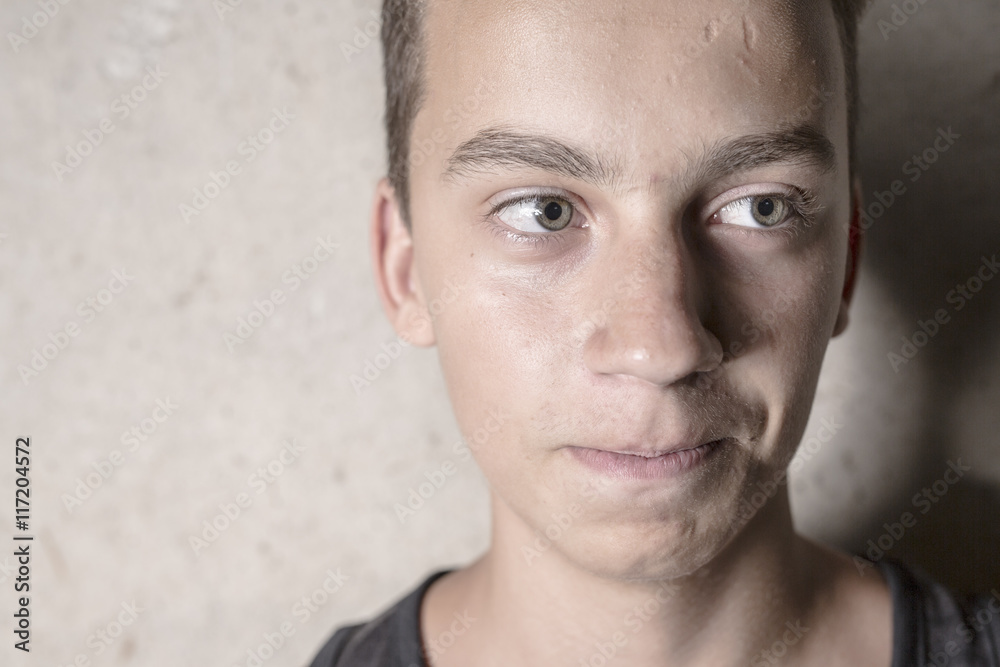 Obraz premium Sad teen boy concrete