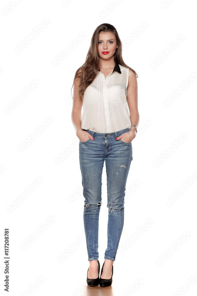 beautiful young woman in jeans and a shirt on a white background beautiful young woman in jeans and a shirt on a white background