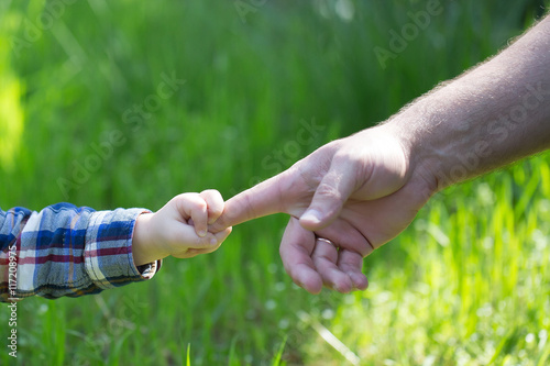 Hands of father and son © Volodymyr