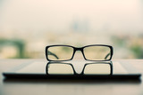 Glasses and tablet closeup