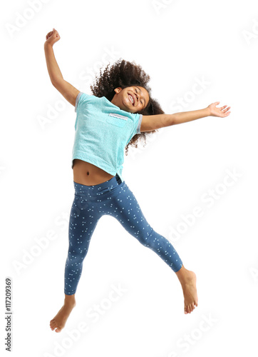 Happy African girl jumping,...