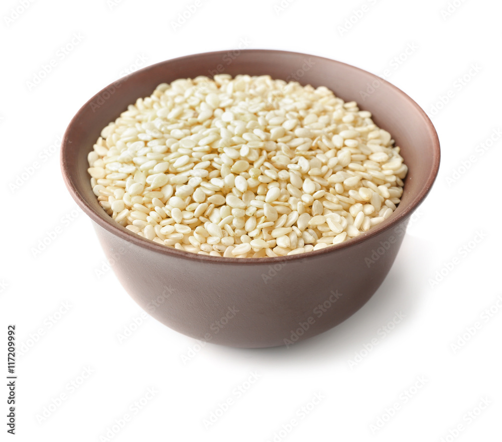 Bowl with white sesame isolated on white Bowl with white sesame isolated on white