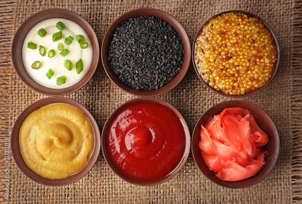 Ταπετσαρία Fresh condiments and sauces on sackcloth napkin