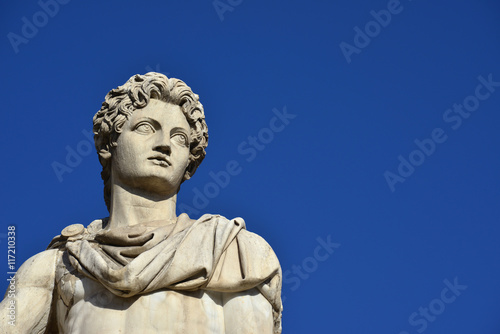 Castor or Pollux with copy space. Ancient marble statue of Dioskouri at the top of monumental balustrade in Capitoline Hill, Rome