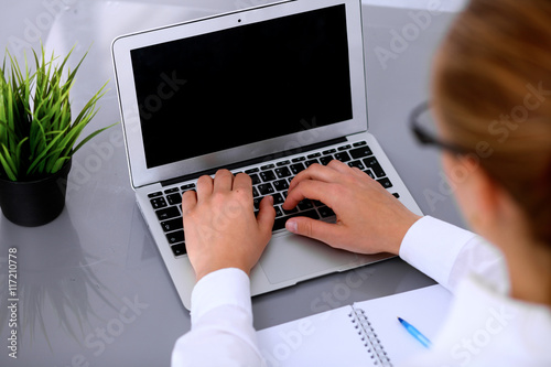 Close-up of Business woman is typing on laptop computer