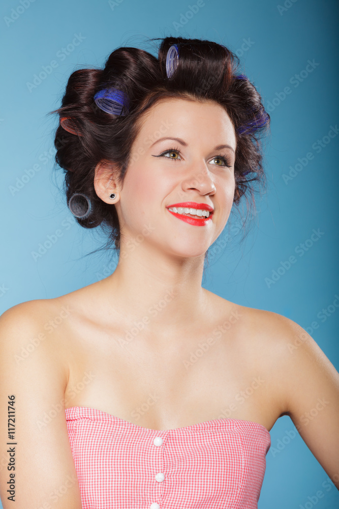 girl with curlers in hair, woman preparing to party.