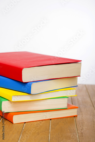 colorful books on wooden table