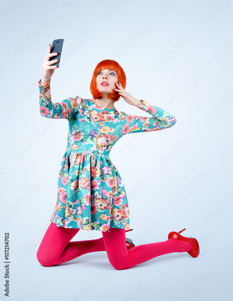 Fashionable young women in dress with smart phone. Make selfie
Fashionable young women in dress with smart phone. Make selfie