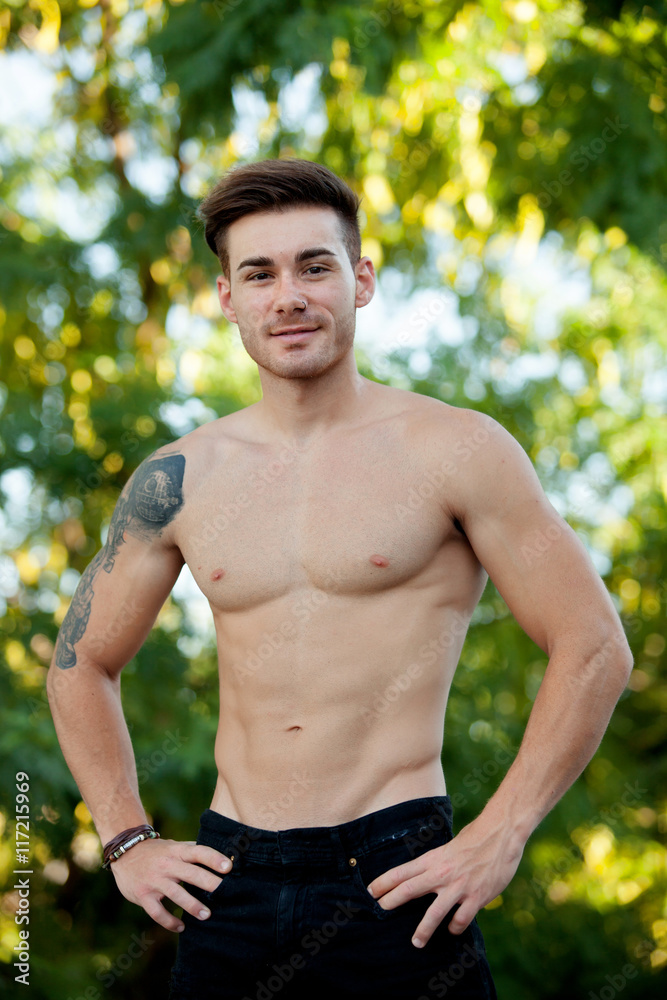 Young boy with showing his muscles. Young boy with showing his muscles.