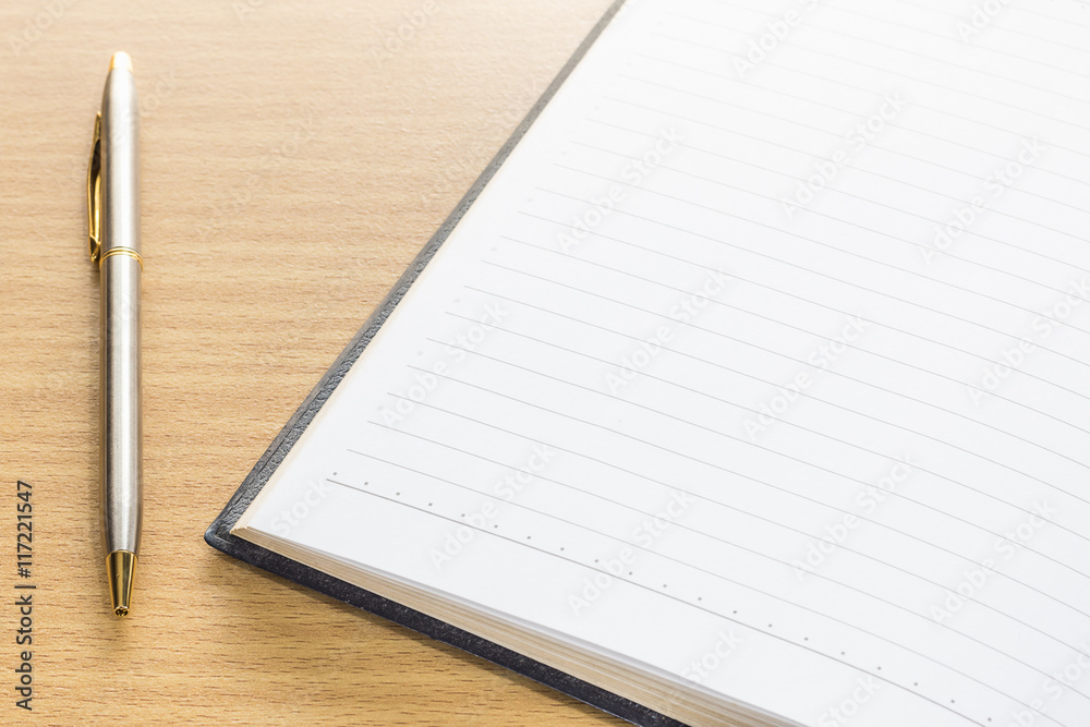 Pen and open note book with blank page Pen and open note book with blank page