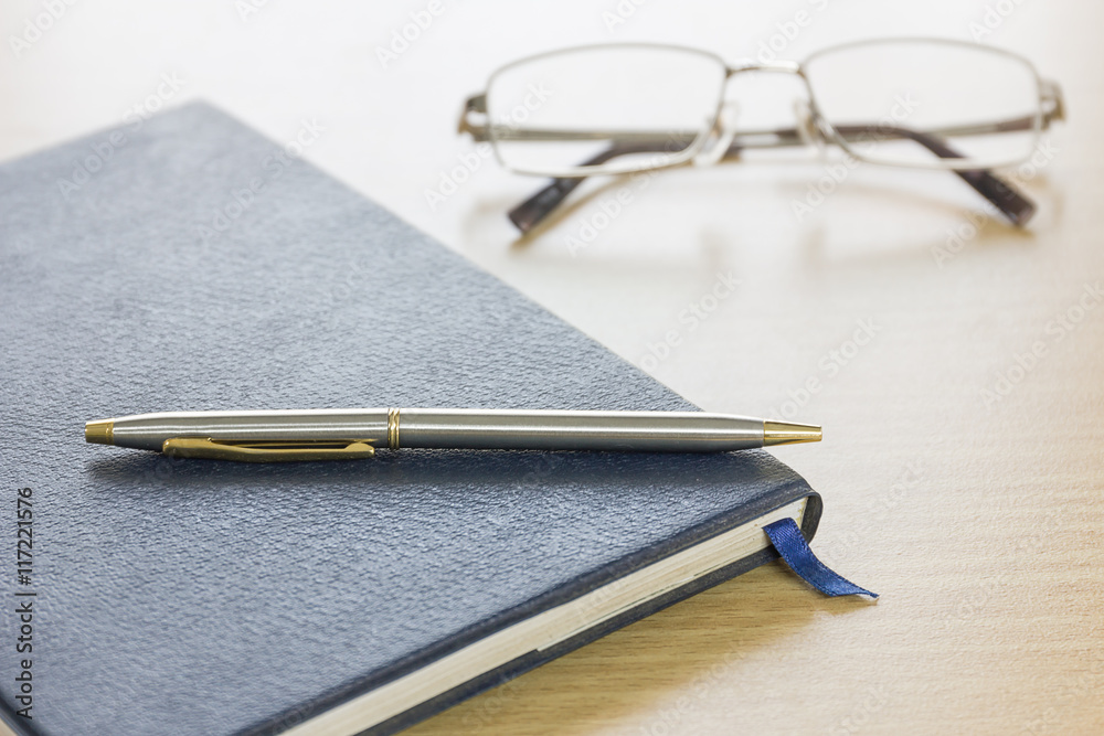 Pen put on notebook Pen put on notebook