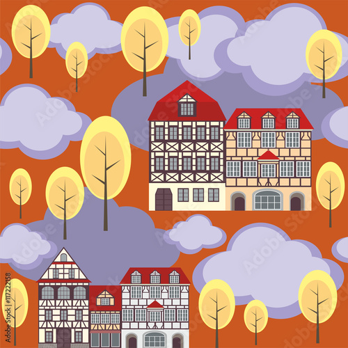 seamless pattern with the image of old town houses, clouds and trees. autumn cityscape.