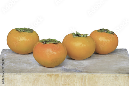 persimmon on wooden cutting boards isolate on white background