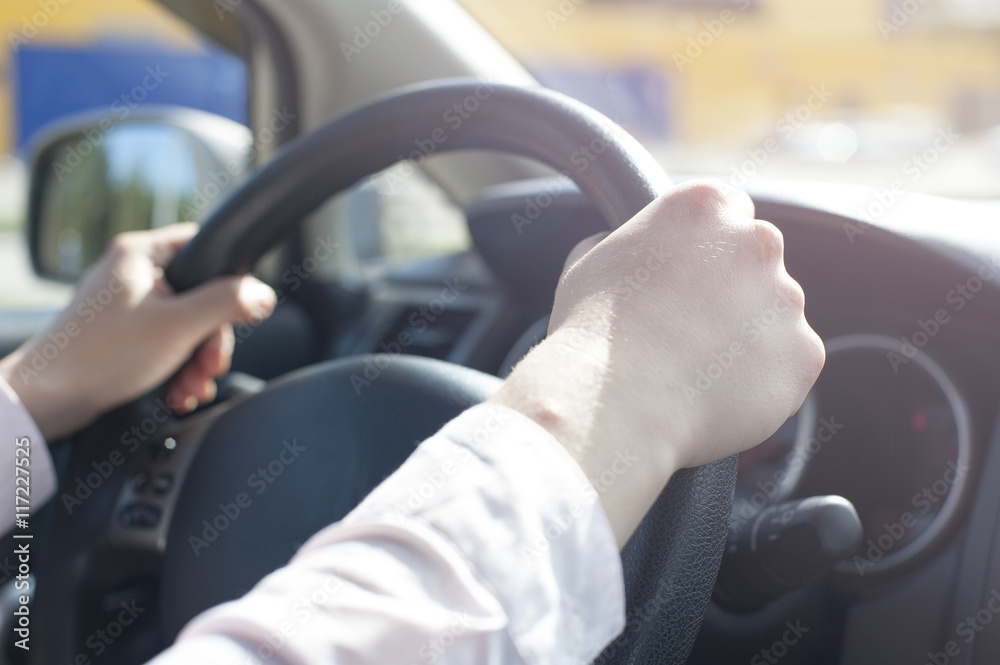 Close-up Of female Hand Holding Steering Wheel Close-up Of female Hand Holding Steering Wheel