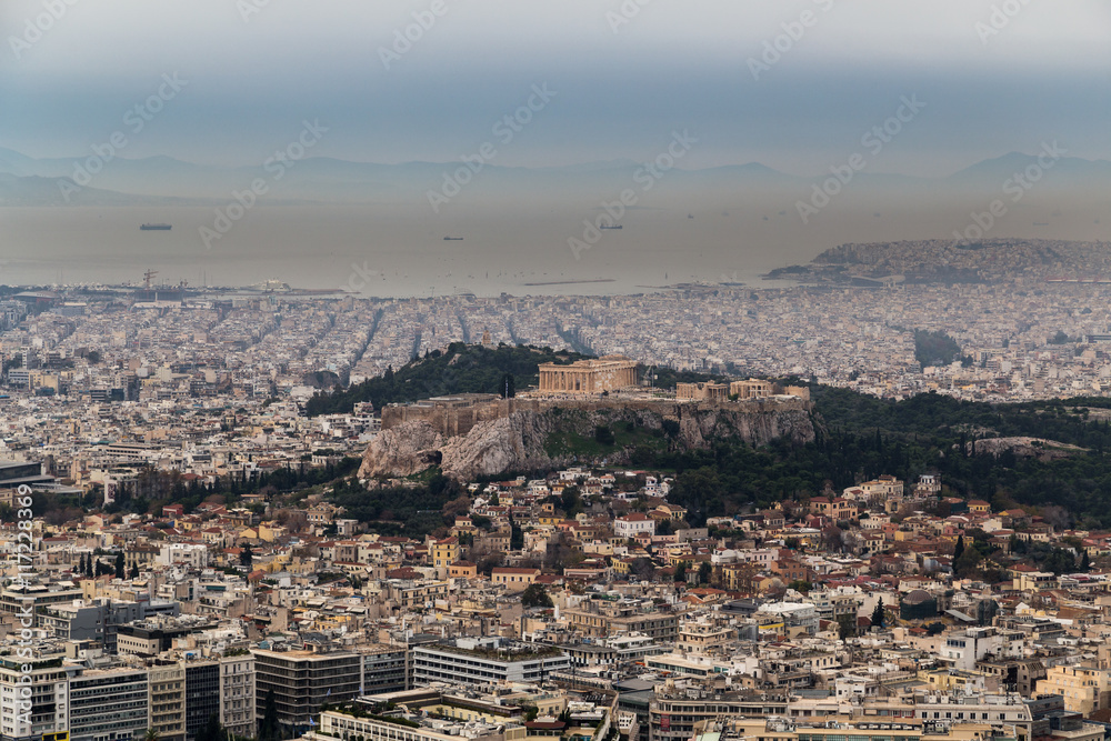 Panoramic view of Acropolis hill and the Parthenon and Athens port in the background on a hazy day