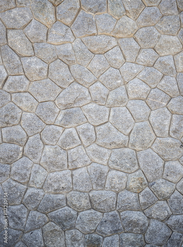 Pattern of grey and rough stone wall texture for background