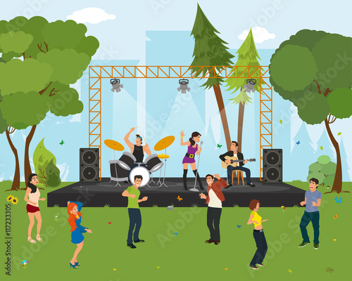 People dancing in the city park at the concert.