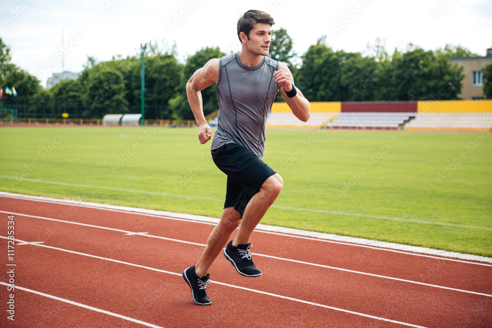Fototapeta premium Sprinter running on athletics tracks