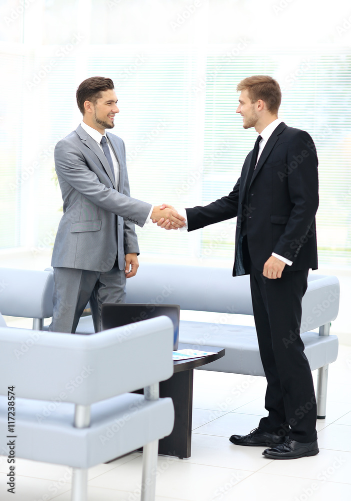 Business people shaking hands during a meeting Business people shaking hands during a meeting