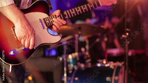 The musician plays the electric guitar