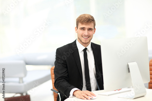 Portrait of happy businessman  at the workplace