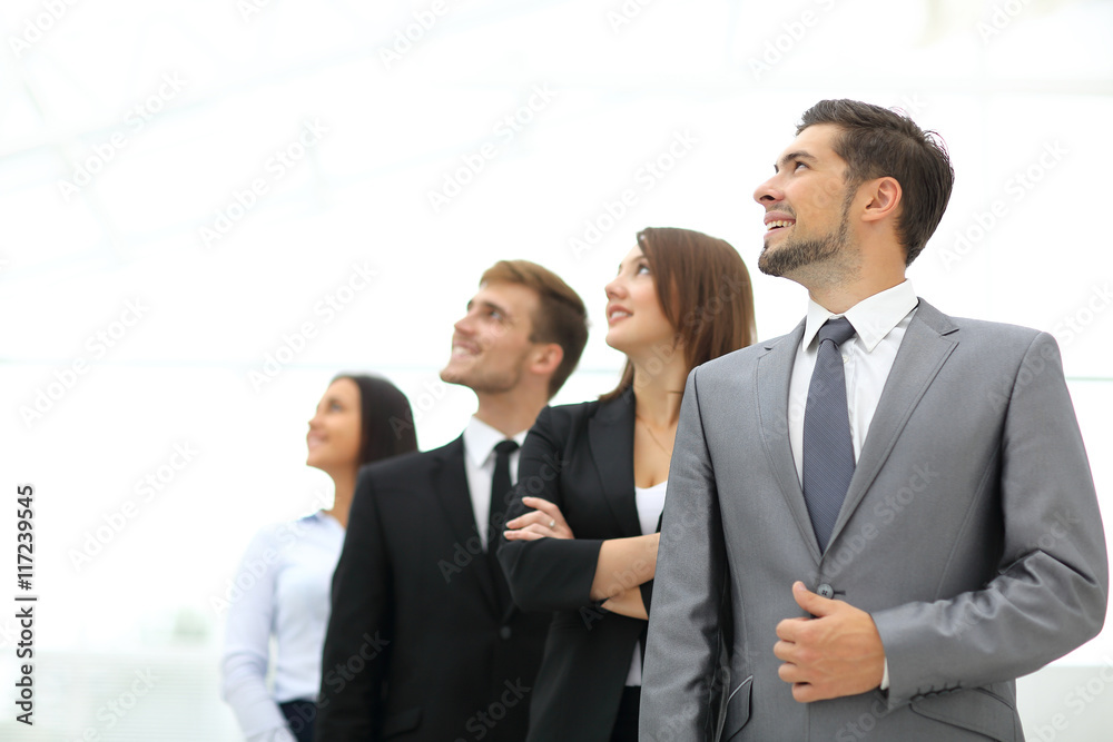 Smiling employee's in a line at work Smiling employee's in a line at work