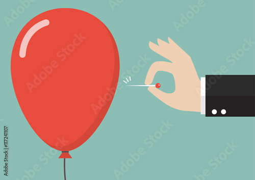 Hand pushing needle to pop the balloon