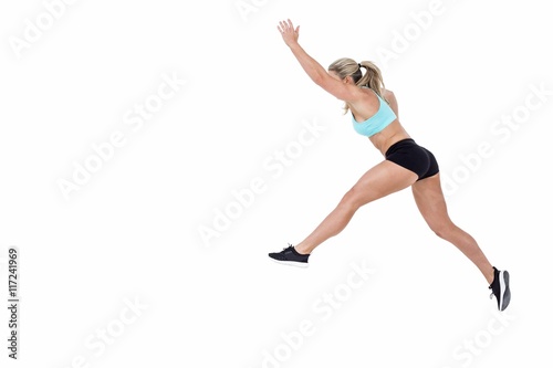 Fototapeta Naklejka Na Ścianę i Meble -  Female athlete jumping