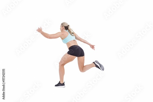 Fototapeta Naklejka Na Ścianę i Meble -  Female athlete jumping