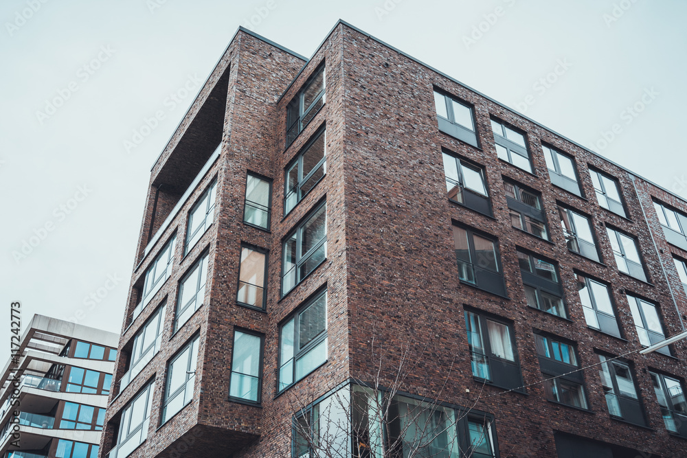 Low angle view of brick apartment housing