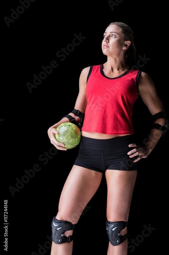 Female athlete with elbow pad holding handball © WavebreakmediaMicro
