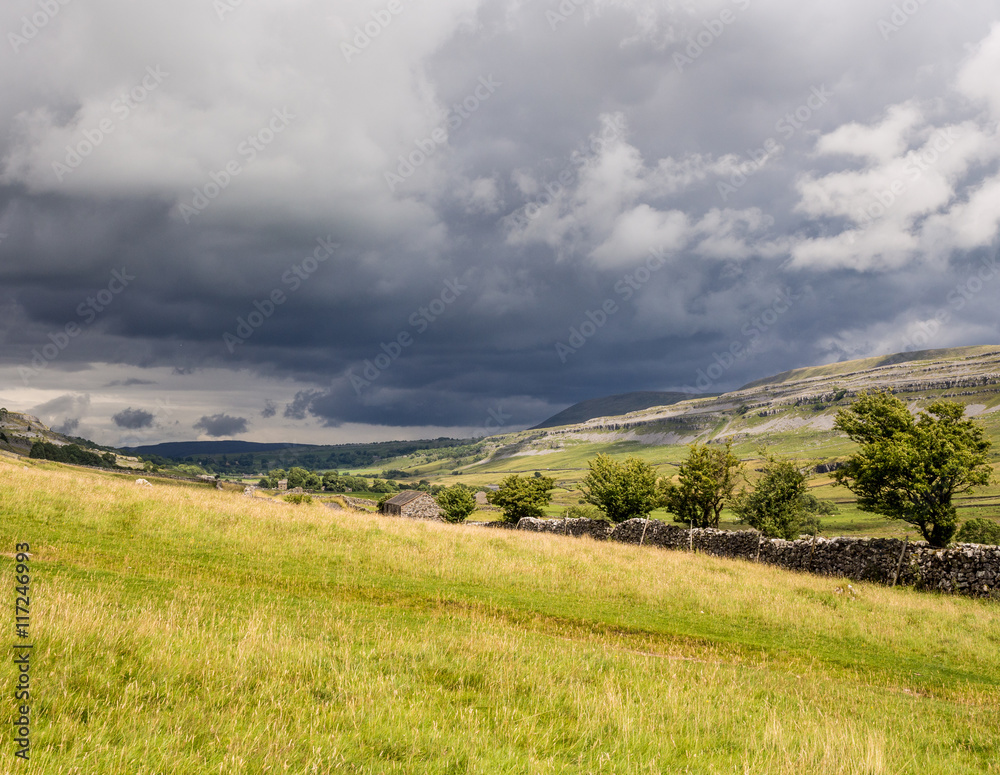 Storm clouds approaching above the Ingleton Waterfalls Trail, Ingleton, North Yorkshire, UK