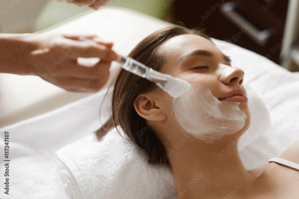 Skin Care. Beautiful Woman Getting Cosmetic Mask At Spa Salon