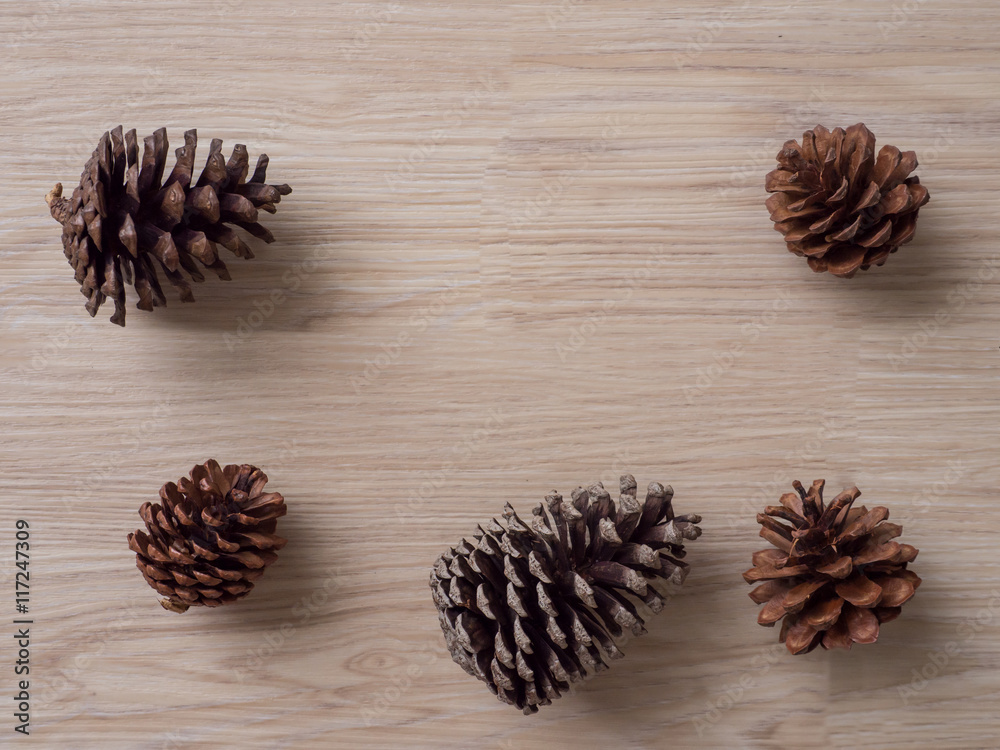 pine cones on wood background pine cones on wood background