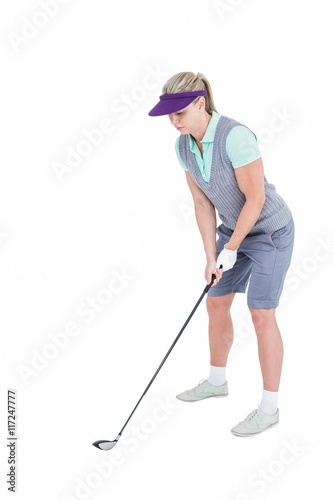Pretty blonde playing golf
