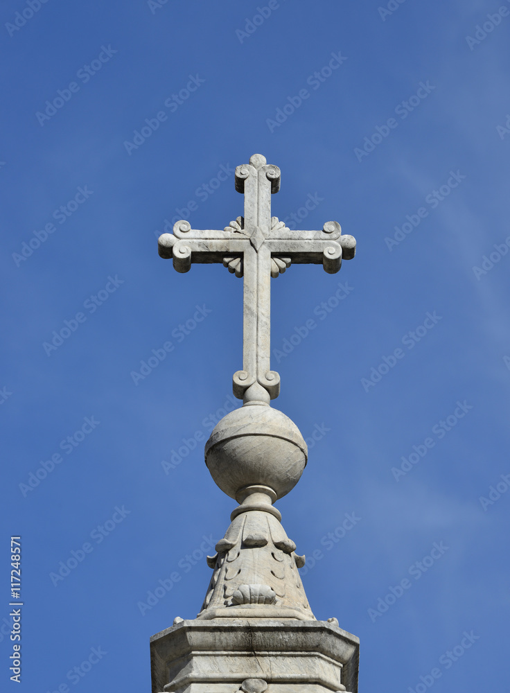 Holy cross at the top of monument erected in Tiberina Island (Rome) and made by sculptor Jacometti in 1869