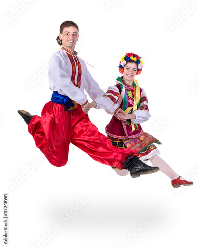 dancing couple in polish national traditional costume jumping, full length portrait isolated