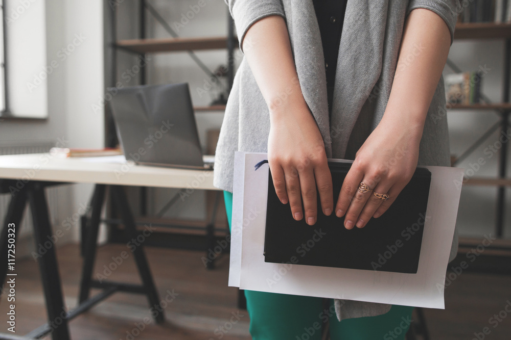 Woman planning vacation, self-development concept. Female manager dreaming about summer rest and write trip plans into notebook Woman planning vacation, self-development concept. Female manager dreaming about summer rest and write trip plans into notebook