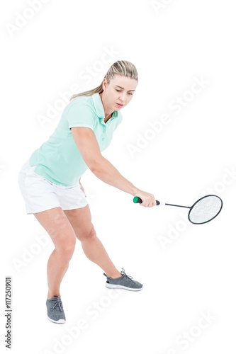 Pretty blonde playing badminton  