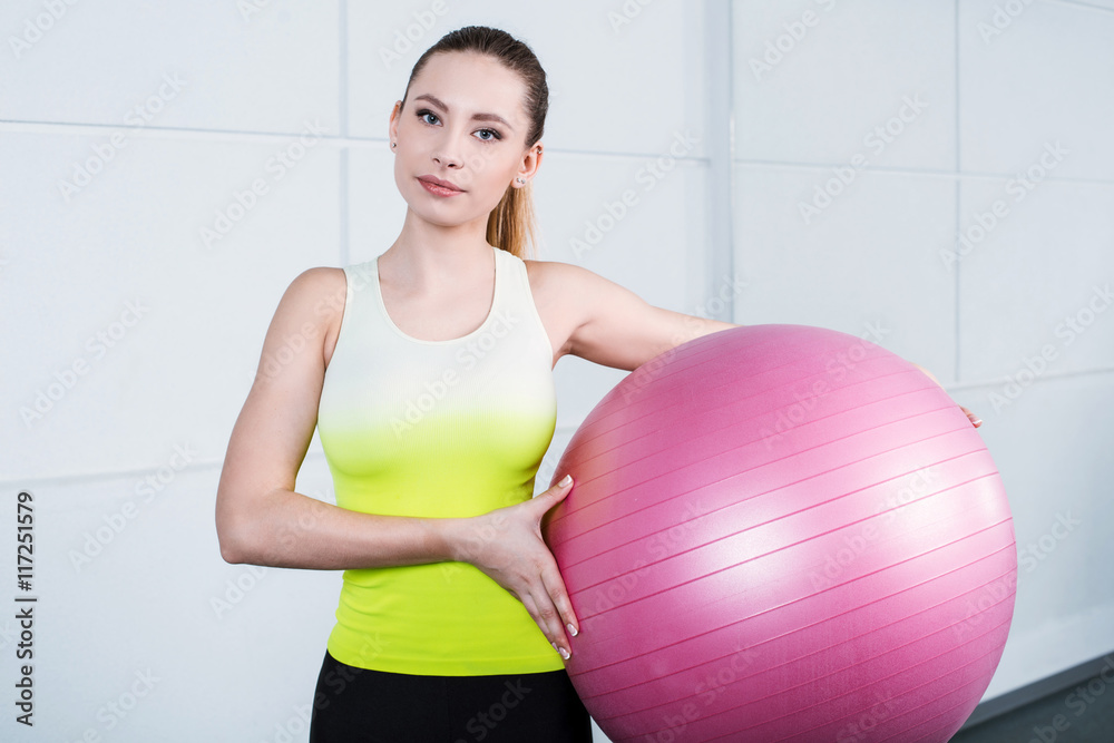 Young woman training at fitness club Young woman training at fitness club