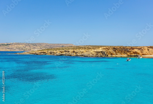 Blue lagoon, famous beach and seafront on Comino island of Malta in mediterranean sea 