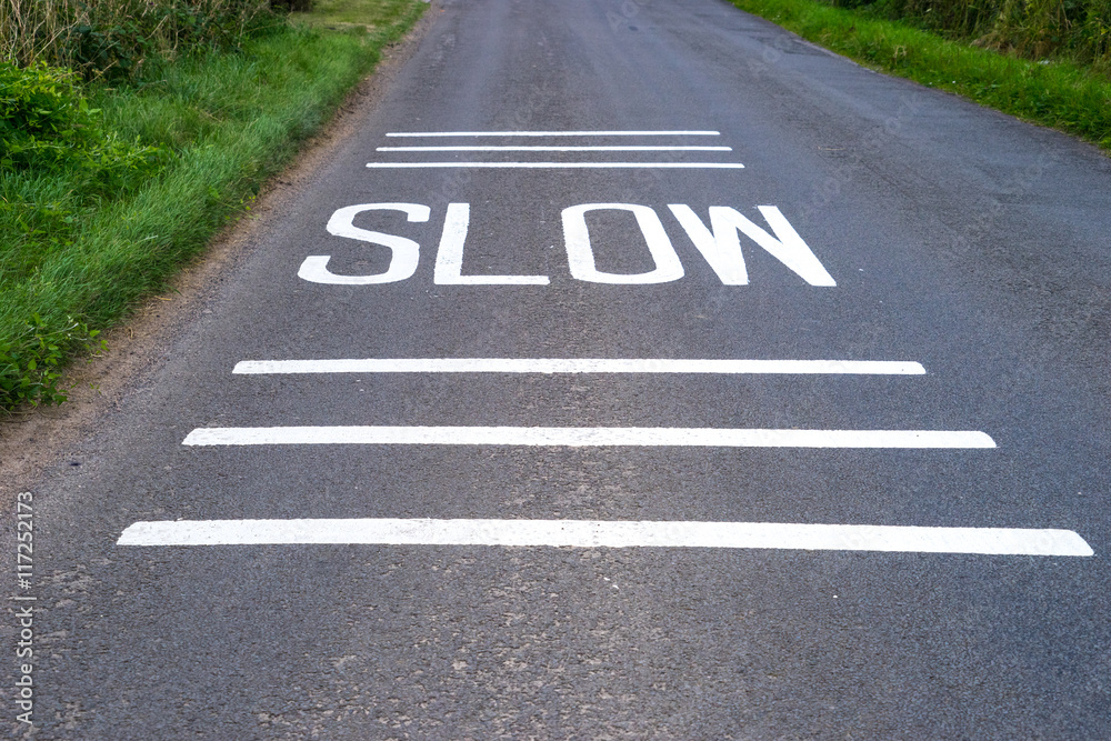 Fototapeta premium Slow Sign freshly painted on road