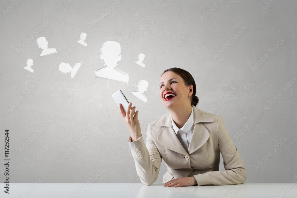 Attractive businesswoman having mobile conversation . Mixed media Attractive businesswoman having mobile conversation . Mixed media