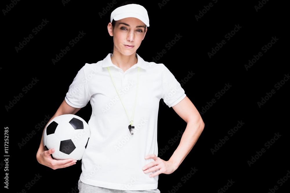 Female athlete holding a soccer ball Female athlete holding a soccer ball