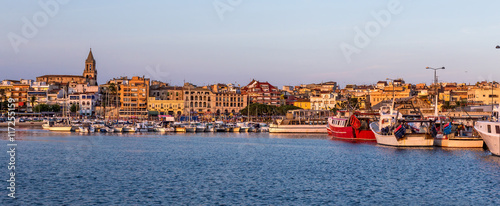 Fishing motor boat on the harbor in Palamos bay of Spain