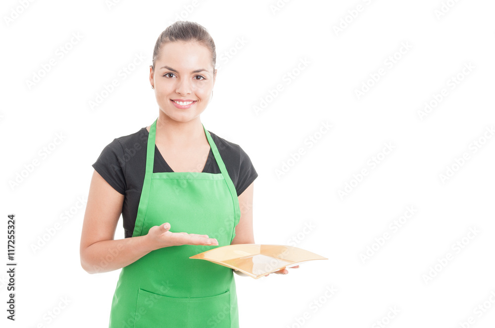 Attractive female employee showing empty dish Attractive female employee showing empty dish