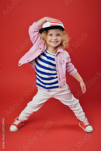 Portrait of a cute little girl in fashionable clothes. beautiful child