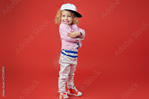 Portrait of a cute little girl in fashionable clothes. beautiful
